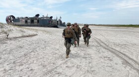 Marines from the 24th MEU pass LCAC 70 on Camp LeJeune.