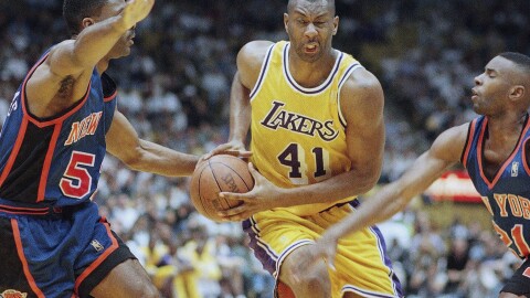 FILE - Elden Campbell (41) of the Los Angeles Lakers drives to the basket as Buck Williams left, and Charlie Ward of the New York Knicks defend, during the second half of their game on Sunday, Feb. 23, 1997 in Inglewood, Calif. (AP Photo/Mark J. Terrill, File)