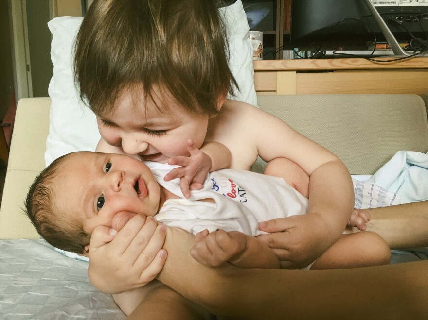 Mikhail Mordasov photographs the day his newborn came home for the first time: "Assol holds her brother in her arms. My wife told me, 'I had a lot of fears about giving birth during a pandemic. I could hardly breathe during the last trimester and imagined myself getting infected. I was thinking about writing a will or notifying medics to save the baby first.' <em>June 15, Sochi, Russia.</em>