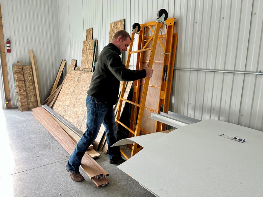 Rancher Lamont Herman collects building materials in a nearby storage unit to build his meat-cutting room at Montana Prime Meats