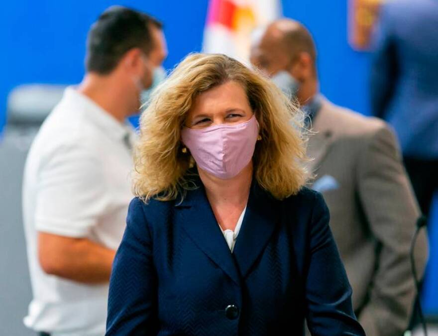 Broward County Public Schools Interim Superintendent Vickie Cartwright. She is wearing a blue blazer and smiling underneath her coronavirus mask.