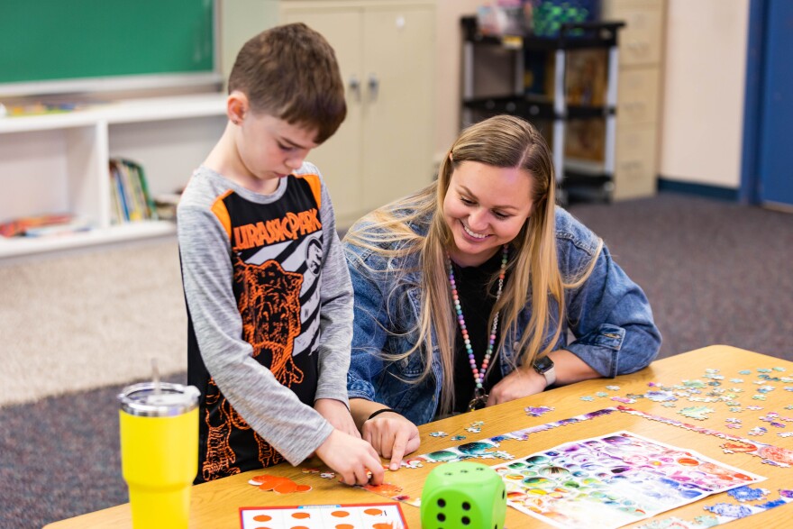 Ms. Carpenter at Elm Grove Elementary School works with an individual student on number instruction.