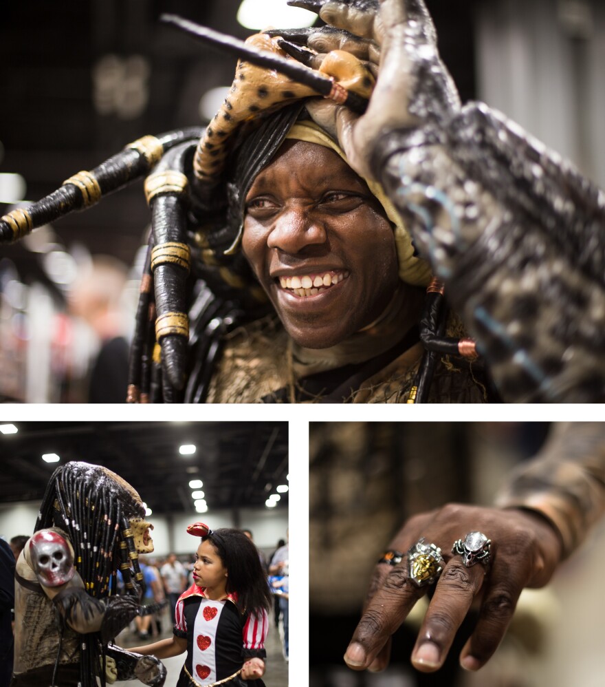 Jayson Brown of Sterling, Va., portrays Predator from the 1987 film. Brown has spent the past two years working on his costume, which includes a Predator ring that he wears even when he's not cosplaying. Brown's daughter Skyla Brown is dressed as the Queen of Hearts from <em>Alice in Wonderland</em>.