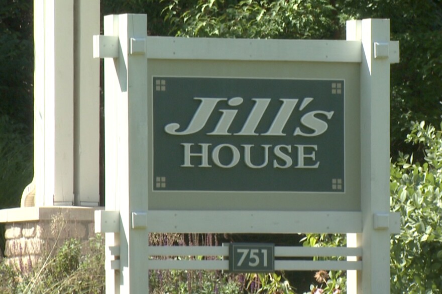 A green and white sign reading Jill's House. 