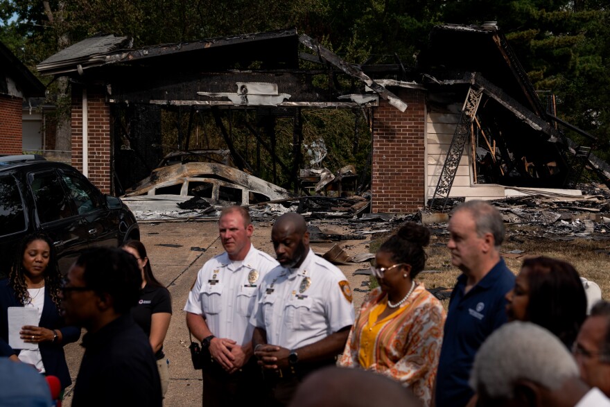 St. Louis County officials hold a press conference in front of a row of homes that exploded on Monday, Aug. 25, 2025, near Black Jack. The blasts damaged at least 20 surrounding residences.
