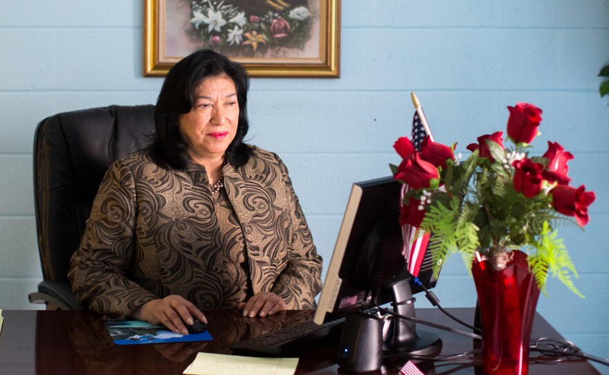Maudia Melendez, minister at Jesus Ministry Inc., sits at her desk inside Statesville Road Baptist Church in Charlotte, N.C.