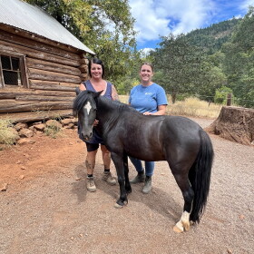 Ruby Ranch owner Kim Ibarra and equine specialist Laura Williams stand with their Welsh pony Simon who currently is in training to become a therapy horse.
