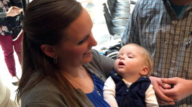 Andrea Clausen holds her son Bryce at the Statehouse.