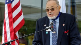 A man speaks at a podium