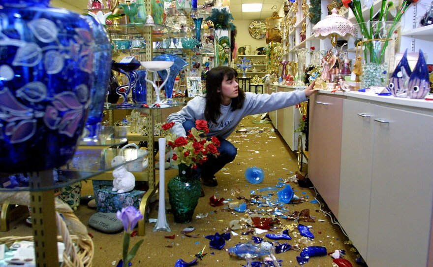 Elizabeth Pearson, 17, cleans her mom's crystal and glass gift shop in Olympia, Wash., Thursday, March 1, 2001. 