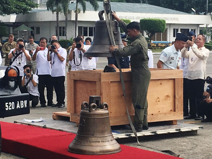 The Balangiga church bells are unloaded in Manila after being in U.S. possession for 117 years.