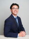 James Wolfgang Perez in a suit and tie.