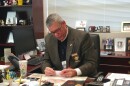 Sam Paeg at his desk