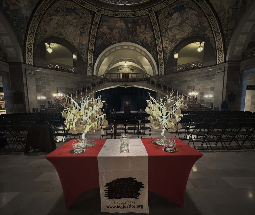 Paper hearts with the names of people who have died in Missouri prisons in recent years hang from two memorial trees in the Missouri state capitol on Jan. 14, 2026. The memorial was part of the Missouri Justice Coalition's Triple Digit Deaths campaign.