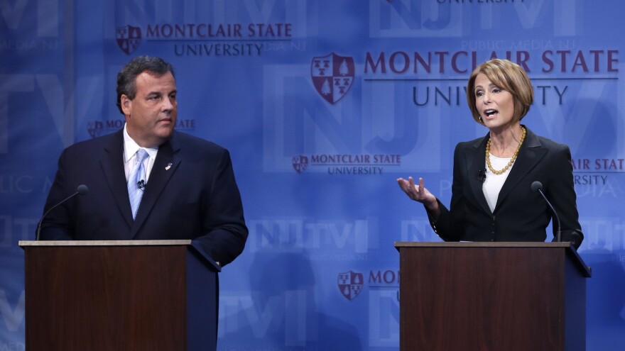 Republican Gov. Chris Christie listens as Democratic challenger Barbara Buono answers a question during a debate at Montclair University in Montclair, N.J., on Oct. 15.