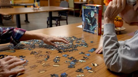 Residents in the memory care unit at the Maplewood Rehabilitation Center work on a puzzle on Tuesday, Sept. 30, 2025, in Maplewood, Minn.