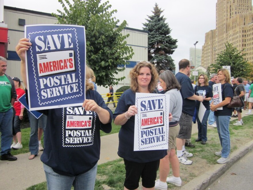 Local postal workers rallied in downtown Buffalo Tuesday