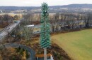 A cell phone tower camouflaged as a tree