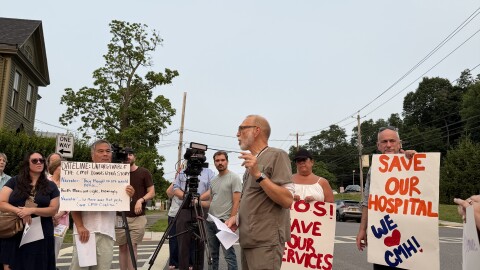 X-ray technician Rob Anderson speaks at a rally outside CMH.