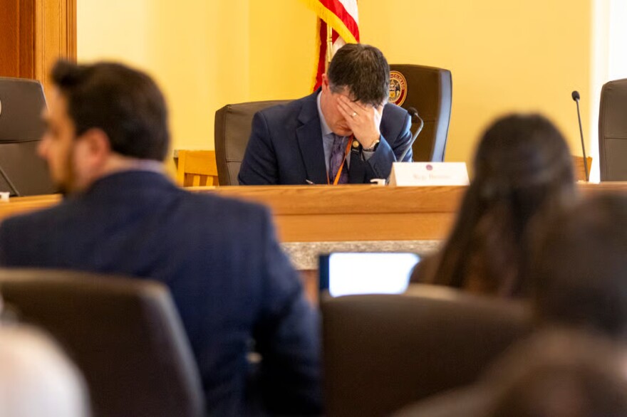 State Rep. Kyle Brown listens as legislative economists Greg Sabetsky and Amanda Liddle speak to the Colorado legislature's Joint Budget Committee about the state's finances. March 19, 2026.