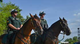 Two Sarasota County Sheriff's deputies on horseback.