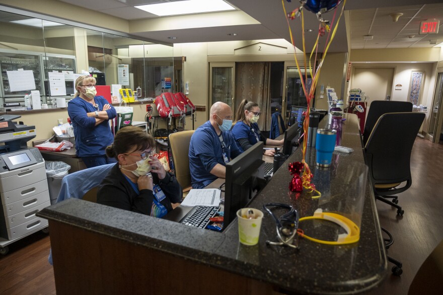 Medical staff at UnityPoint Methodist Hospital's Intensive Care Unit check on the number of COVID-19 patients in the unit. The sickest COVID-19 patients often spend long amounts of time in the unit.