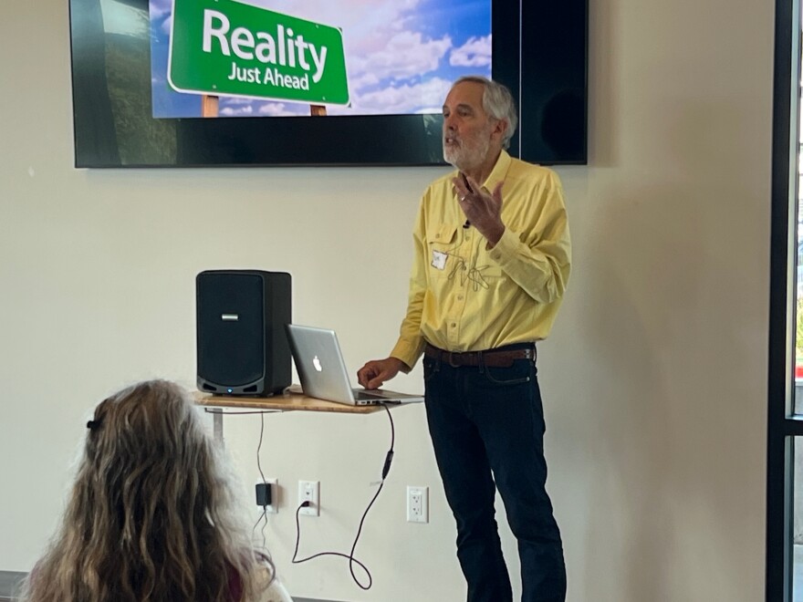 Rick Longinotti, chairman of the Campaign for Sustainable Transportation, addresses a community meeting about the Highway 1 reconstruction project at the Aptos Branch Library on March 30, 2024.