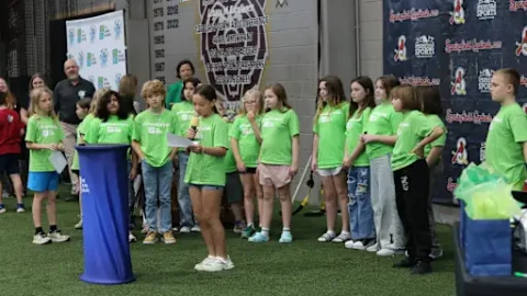 Elementary students in the Springfield Public Schools District present checks to local charities in April 2026.