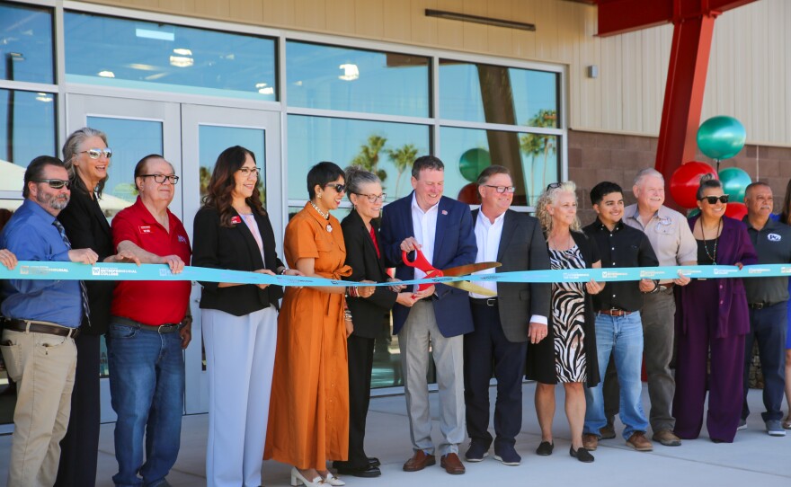 Dr. Daniel Corr, president of AWC, cuts the ribbon on the new Future48 Workforce Accelerator in Wellton. On his immediate left, Arizona Governor Katie Hobbs and incoming AWC president, Dr. Reetika Dhawan. On his immediate right, Keith Watkins of the Arizona Commerce Authority and Wellton Mayor Michelle Jones. Also pictured: Arizona Western College governing board members and leadership, plus student Enrique Gonzalez.
