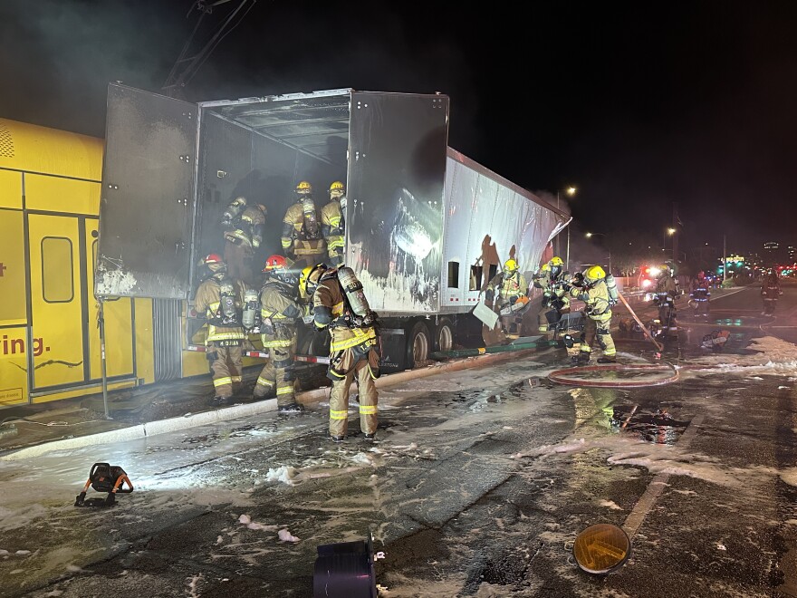 Firefighters respond to light rail and semi-truck collision.