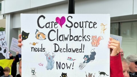 Behavioral health providers protest attempted recoupment policy outside of CareSource headquarters.