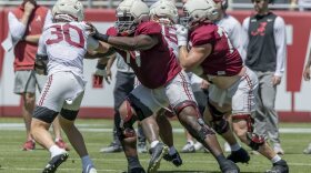 FILE - Alabama offensive lineman Jaeden Roberts (77) blocks against linebacker Cayden Jones (30) during Alabama's A-Day NCAA college football practice and autograph session, April 12, 2025, in Tuscaloosa, Ala. (AP Photo/Vasha Hunt, file)