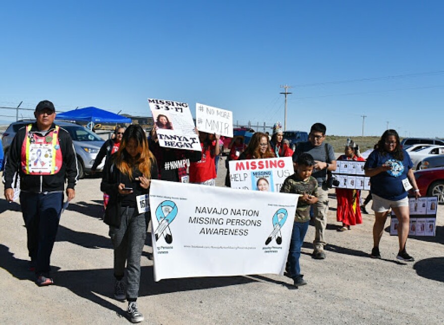 Photo of people marching at a rally.