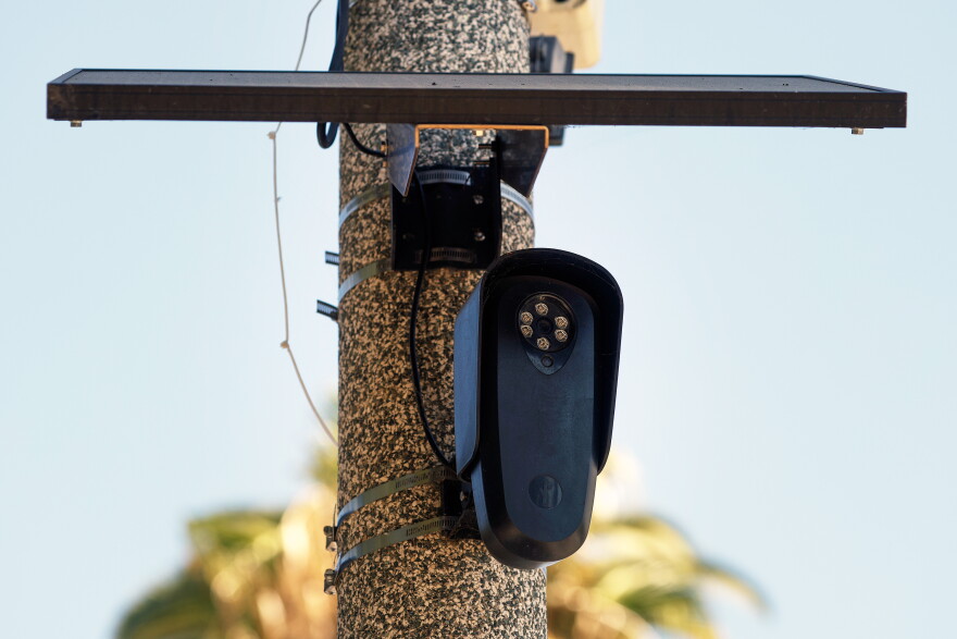 A Flock Safety camera is shown mounted to a light pole on August 03, 2026 in Beverly Hills, California. Flock Safety's automated license plate reader cameras have been deployed in over 120,000 locations across 49 states, using artificial intelligence to identify vehicles by their license plates, make, model and color to help law enforcement investigate crimes, while also drawing criticism from privacy advocates over concerns about mass surveillance and the collection of motorists' location data.