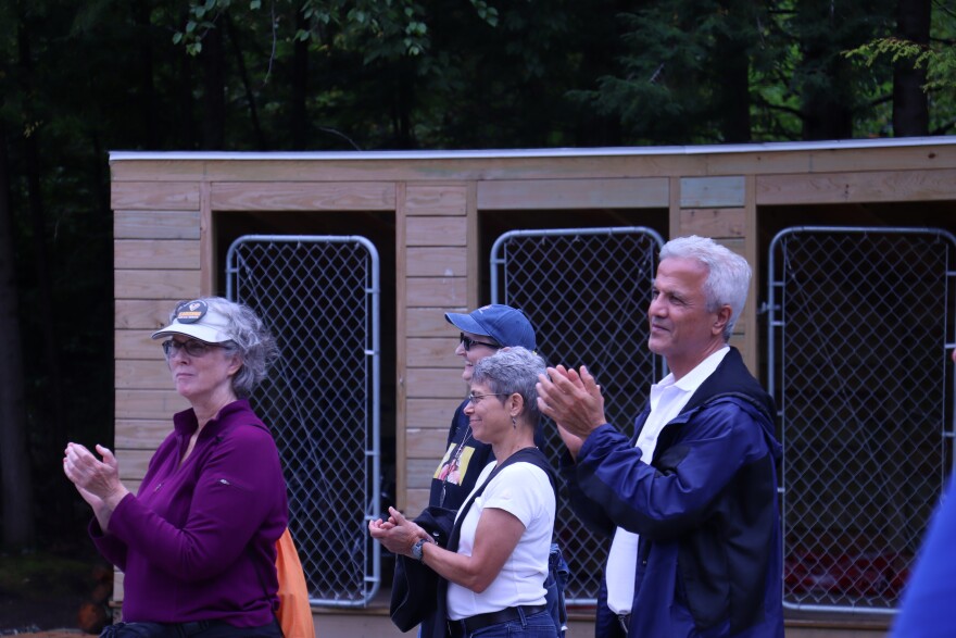 Some attendees of the Rebel River Fest at Suncook River Campground listening to candidates Aug. 23, 2026.