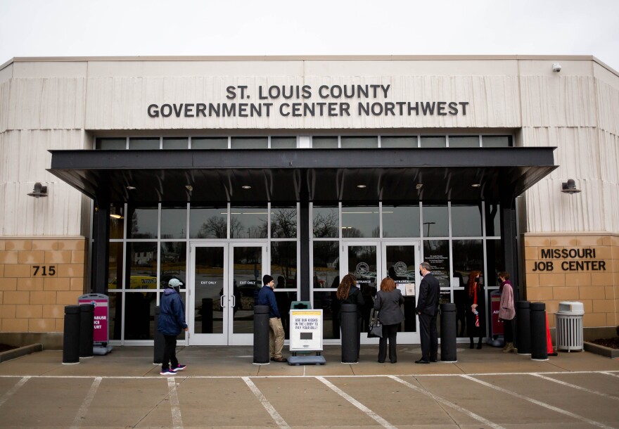 Political candidates outside of a government building.