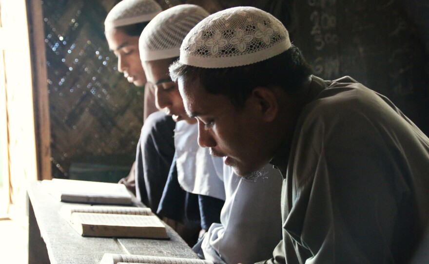 Rohingya students recite from the Quran at a madrassa, or Islamic school, outside Sittwe. About 70 percent of the students at the madrassa are internally displaced persons. Their options for education are limited, and Sittwe University stopped admitting Rohingya students after 2012.