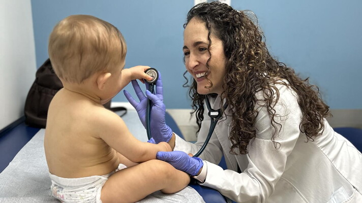 Dr. Gabriela Garrote treating a patient at Gables Pediatrics.