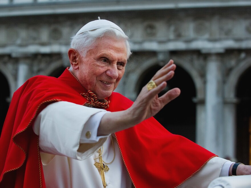 Pope Benedict XVI greets a crowd in Venice's St. Mark's Square in 2011.