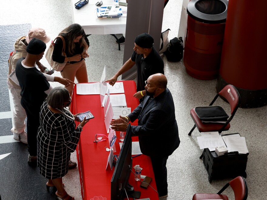 Recruiters speak to job seekers at the Mega South Florida Job Fair held at the FLA Live arena in Sunrise, Florida, on Feb. 23, 2023. Employers added over 500,000 jobs in January, an unexpectedly strong showing for the labor market.