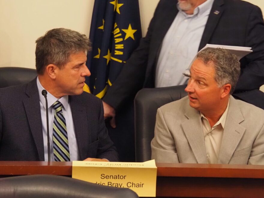 GOP Senate President Pro Tempore Rodric Bray, left, and House Speaker Todd Huston, right, speaking to each other