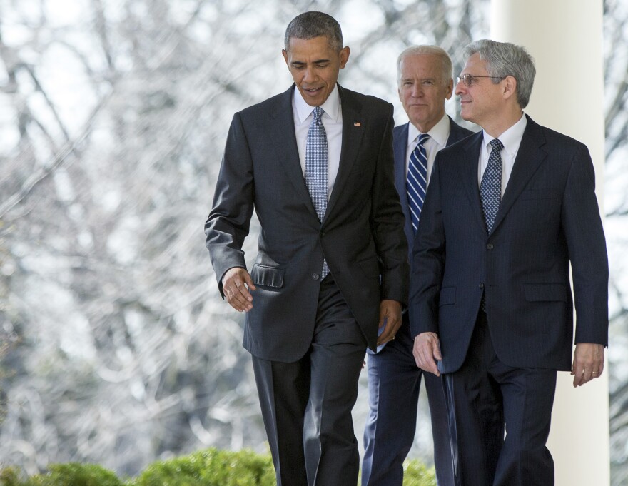 Federal appeals court judge Merrick Garland walks with President Barack Obama and Vice President Joe Biden from the Oval Office to the Rose Garden to be introduced as Obama’s nominee for the Supreme Court at the White House, Wed., March 16, 2016.