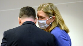 photo of Introcaso speaking with her attorney Michael Delaney