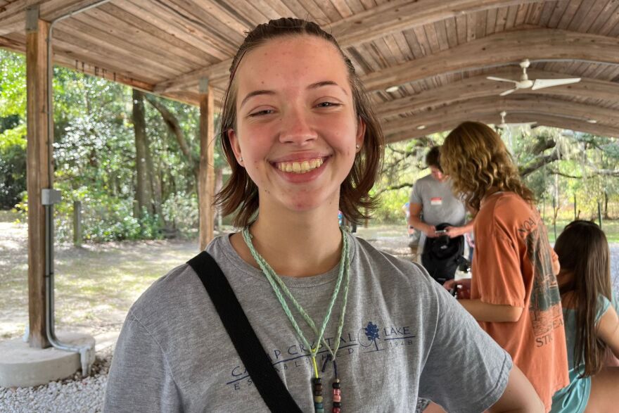 Rebecca Klopper, a hopeful counselor in training, wears her harmony chords around her neck, which signify her summer camp classes. (Ginger Koehler/WUFT News)