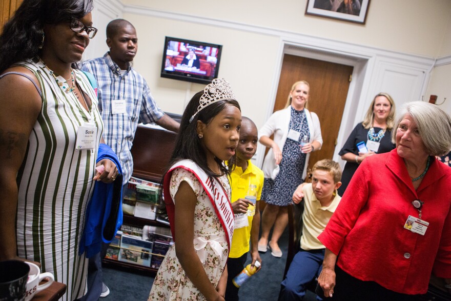 Tymia enters the office of South Carolina Rep. Mark Sanford, a Republican, as part of a lobbying trip organized by the Children's Hospital Association.