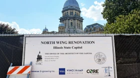 A sign shows the parties involved in construction on the north wing of the Illinois State Capitol.