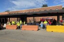 Volunteer staff assist clients at St. Vincent de Paul Food Pantry during food distribution.