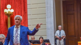 Rep. Jason Knight, a Barrington Democrat, defends his bill to ban assault-style weapons during debate on the House floor on June 5, 2025.