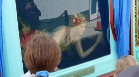 Una the Mermaid in her traveling show tank, which was parked beside the new museum near Aberdeen, Washington. (Tom Banse/Northwest News Network)