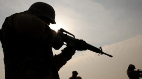 Afghan soldiers, armed with U.S.-made M-16 rifles, take part in combat training in 2009. (Shah Marai/AFP/Getty Images)